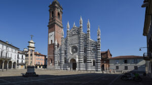Basilica of San Giovanni Battista in Piazza Duomo, Monza, with its Gothic façade, bell tower, and column