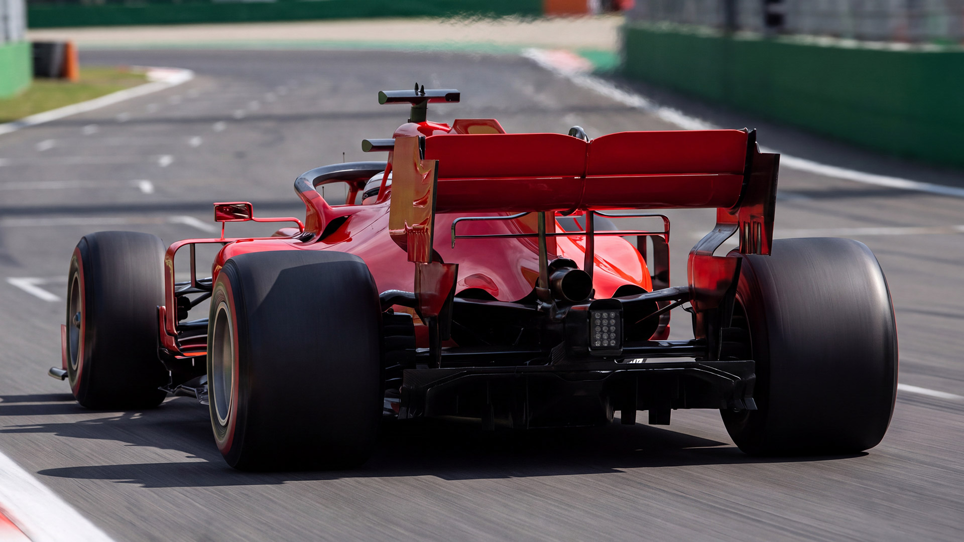 Formula 1 Italian Grand Prix 2027 - Dates, Tickets, Monza Circuit & Travel Guide 6 Rear view of a red Formula 1 car racing at Monza Circuit